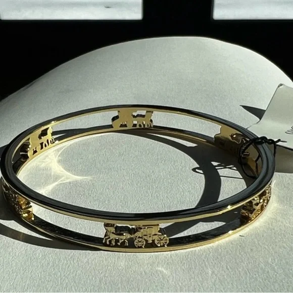 Coach Elegant Gold Bracelet with Carriage Design - Picture 1 of 3